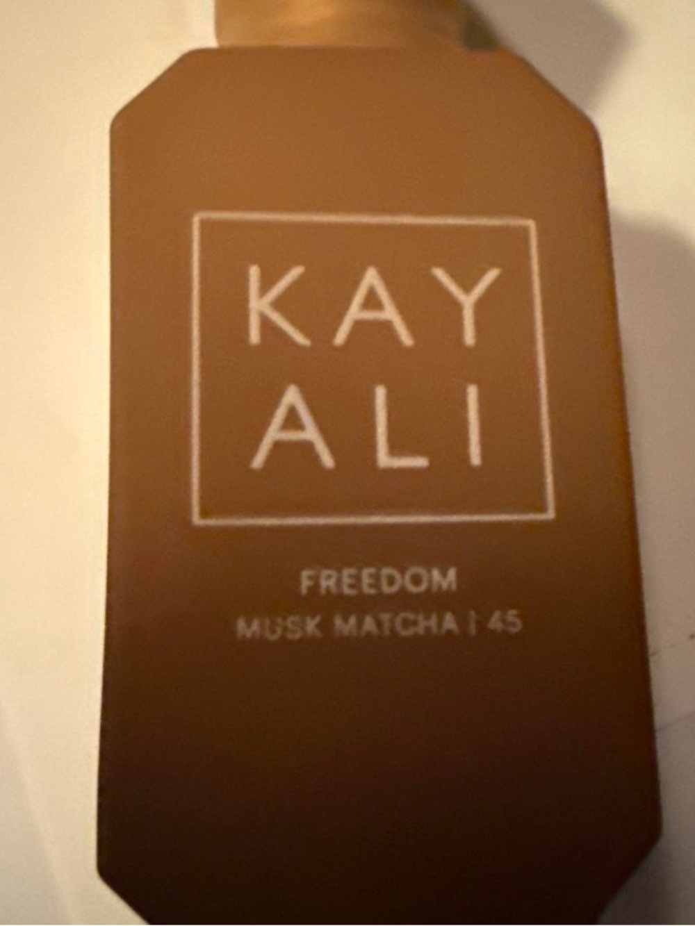 Kayali Freedom Musk Matcha 45 Brown Cell Phone Cover
